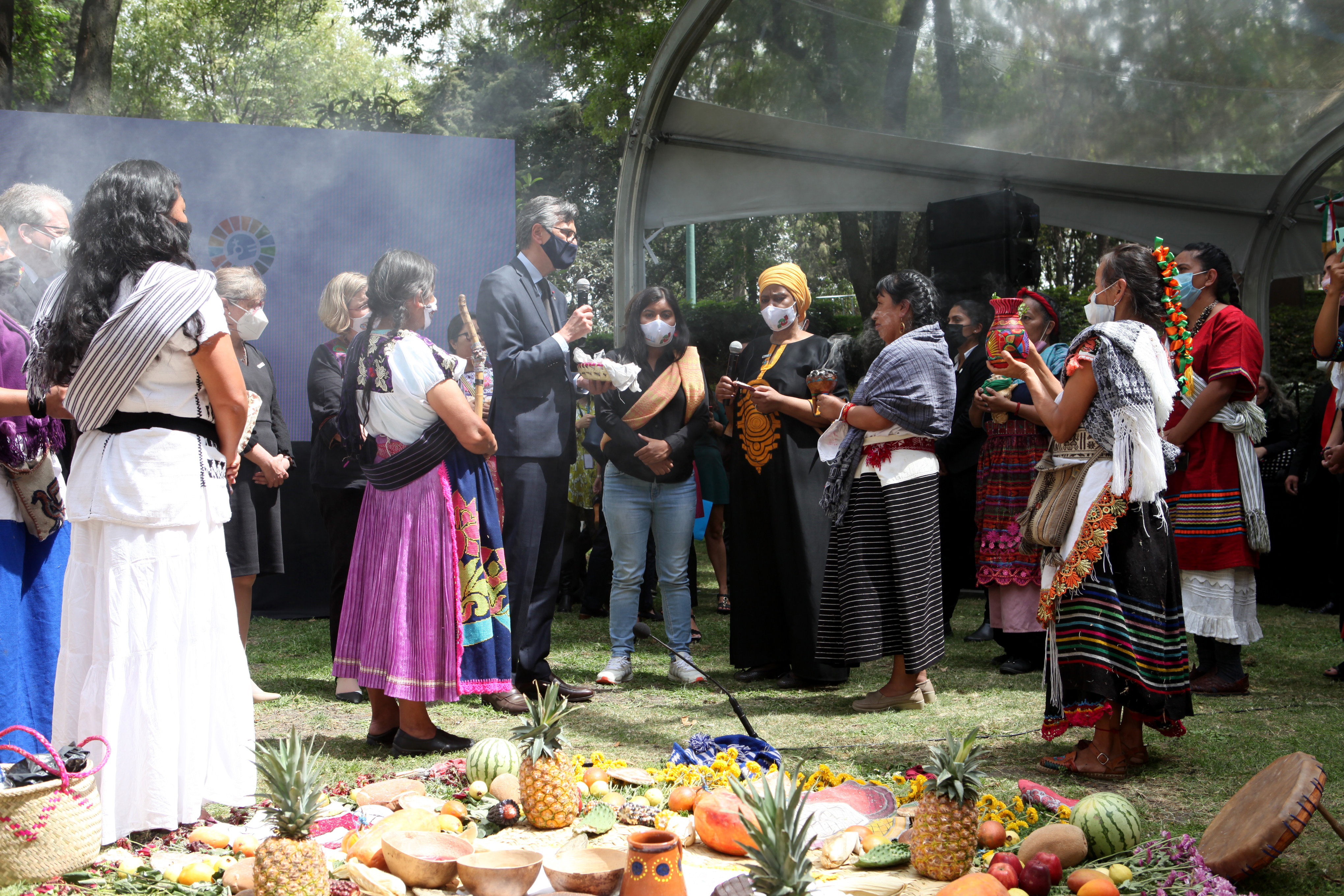 At the closing ceremony of the Generation Equality Forum in Mexico, the torch that has burnt for the duration of the three days is ceremonially symbolically passed to the French Ambassador in Mexico, Jean-Pierre Asvazadourian. Photo: UN Women/Paola García